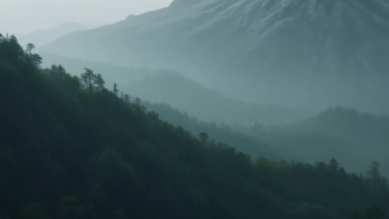 A smooth granite dome above a green valley at sunrise with soft haze, the MoneyGranite view of online loans with fast decisions, $100 – $5,000